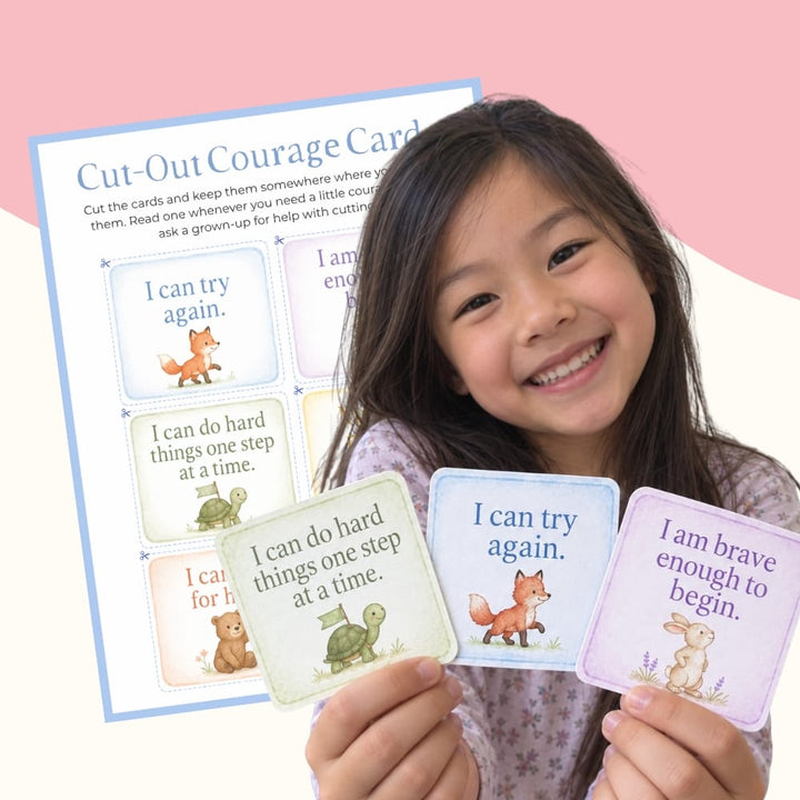 Smiling girl holding Cut-Out Courage Cards from the Confidence Builder Kit